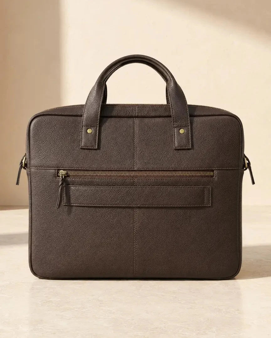 Back view of The Wayfarer leather laptop bag with rear zipper pocket and trolley sleeve