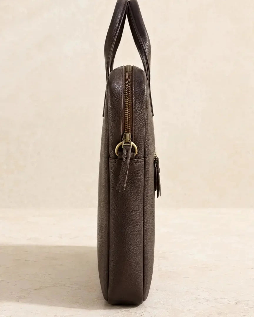 Side profile of The Wayfarer slim dark brown pebbled leather laptop bag