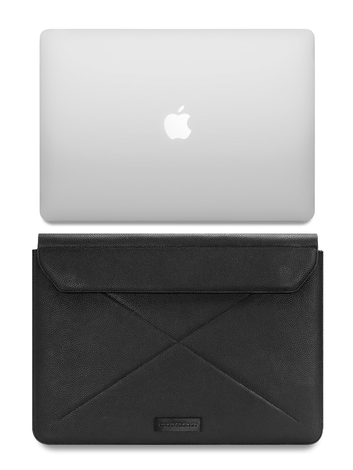 The Envoy black leather sleeve shown with a laptop for scale