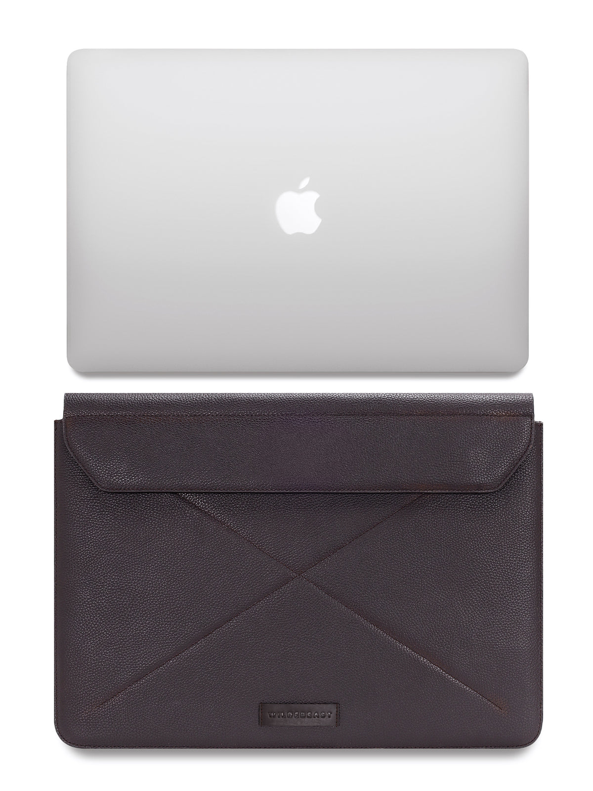The Envoy brown leather sleeve shown with a laptop for scale