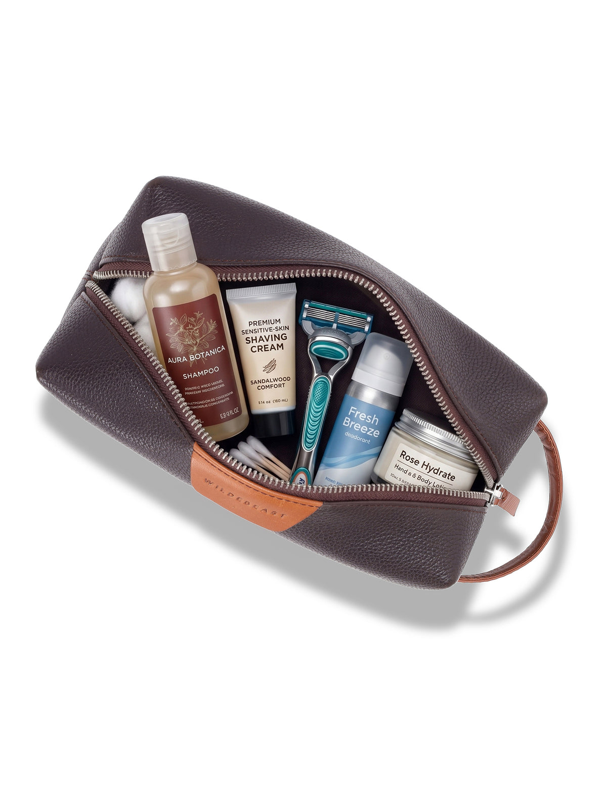 The Geeky Dopp Kit open, packed with toiletries and a razor