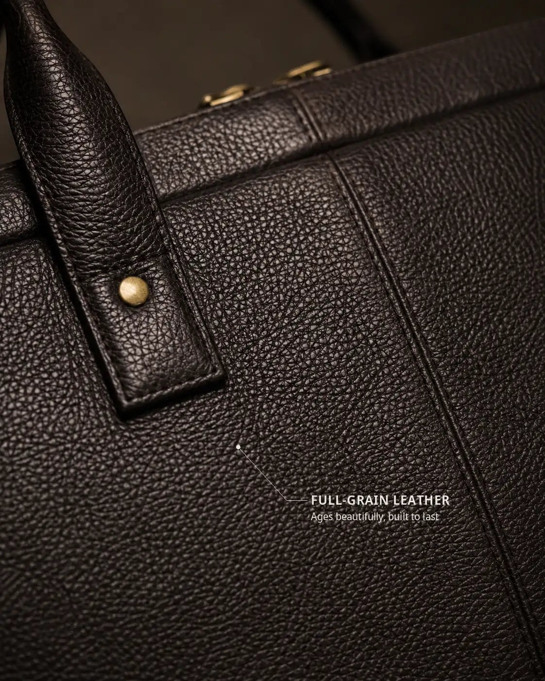 Close-up of Wildebeast The Wayfarer work bag in dark brown full-grain pebbled leather with antique metal hardware.