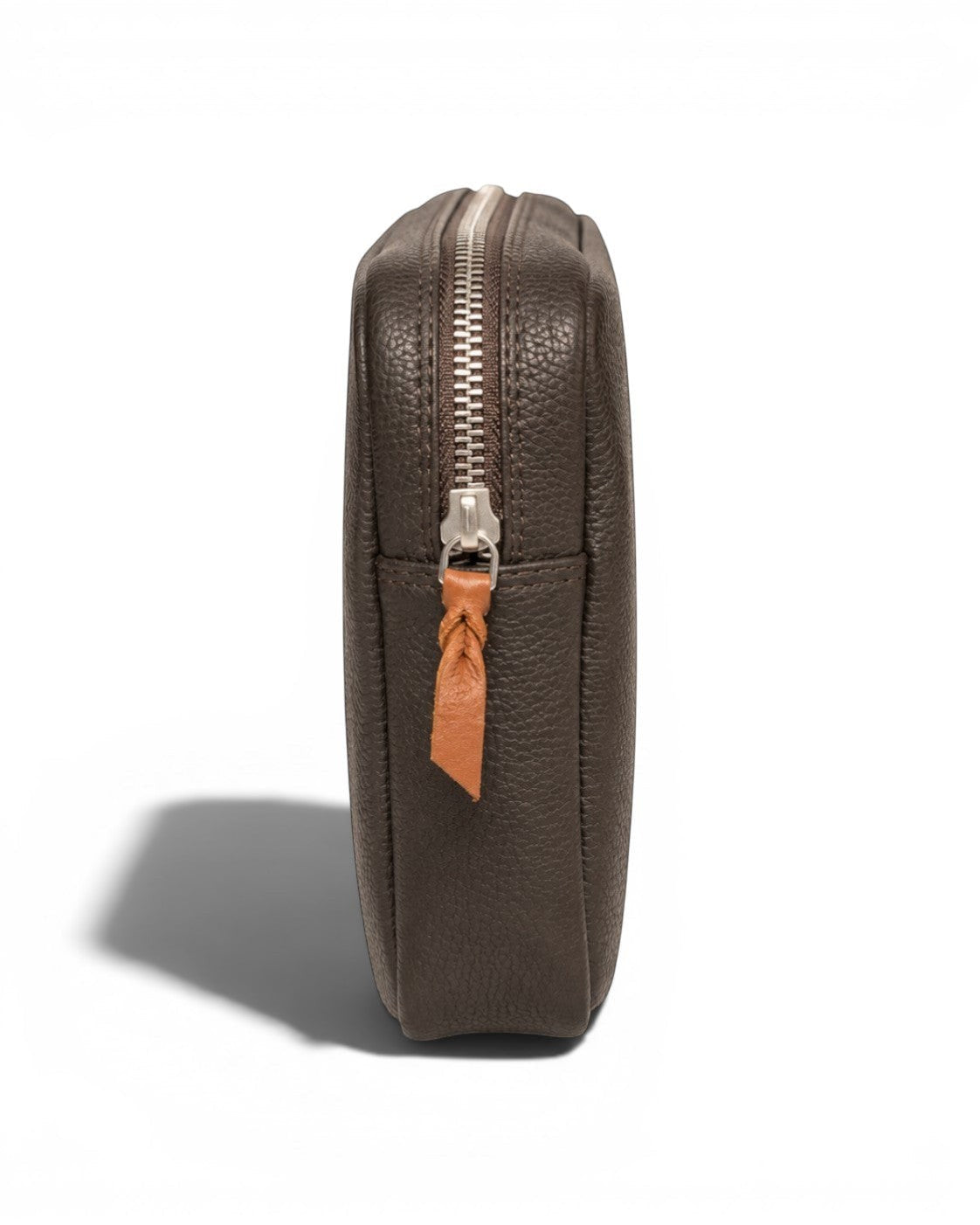 Wildebeast The Relay dark brown pebbled leather tech organiser pouch with a silver zip and tan leather pull, side view