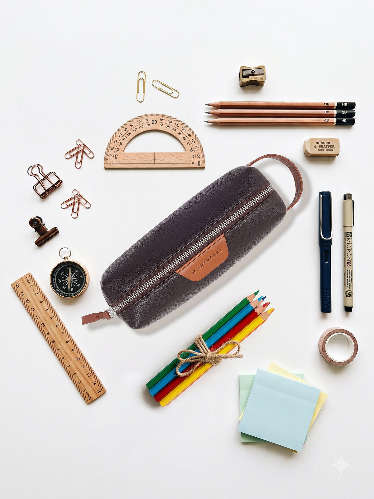 What fits in The Stash Pencil Kit: pens, pencils, ruler, protractor, compass and sticky notes
