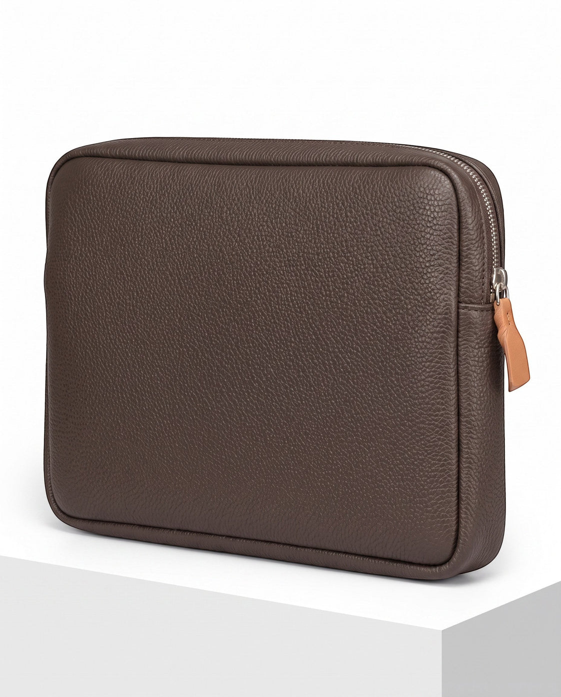 Wildebeast The Relay dark brown pebbled leather tech organiser pouch with a silver zip and tan leather pull.