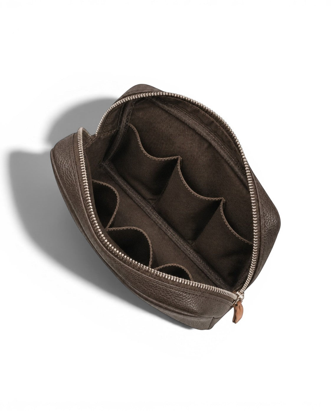 Wildebeast The Relay brown pebbled leather tech organiser pouch with six interior slots and a central compartment.